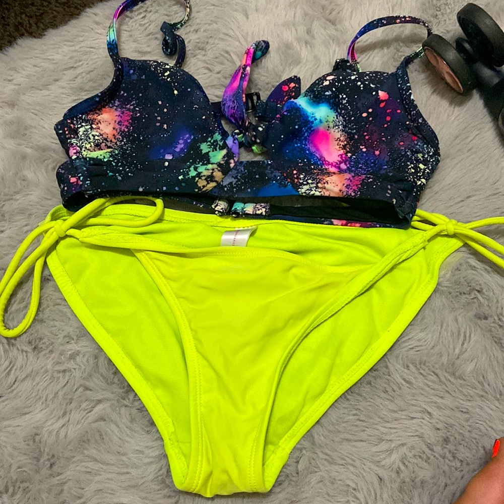 I am selling a bikini bottoms are yellow top is galaxy
